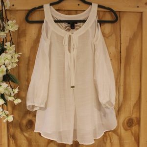 White sheet cold shoulder top